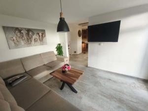 a living room with a couch and a coffee table at Chata pod loukou in Tvarožná Lhota