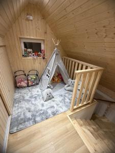 an overhead view of a play room in a wooden house at Chata pod loukou in Tvarožná Lhota +68 photos