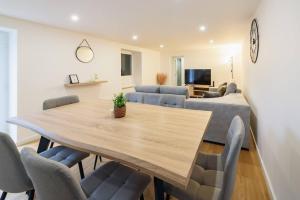 a dining room with a table and chairs at Santo Wellness Villa by Mth in Santo António da Serra
