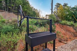 a metal object sitting on the side of a hill at Dreamers Oasis in Sevierville
