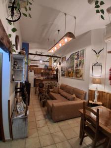 a living room with a couch and a table at Corazón de Mágina in Bedmar