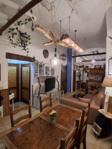 a living room with a table and a couch at Corazón de Mágina in Bedmar