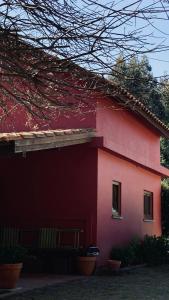 a pink house with a window on the side of it at Casa de Margacide in Vila Nova de Cerveira +62 photos