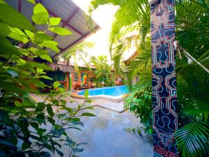 a courtyard with a pool in a house with trees at Amazon City in Pucallpa