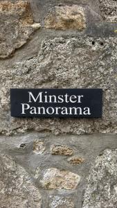a sign on the side of a stone wall at Minster Panorama & Minster Vista - - UNBROKEN BEACHFRONT VIEWS - - TWO STUNNING GEORGIAN HOUSES THAT CONNECT - - PRIVATE PARKING - - Beautifully Refurbished MARCH 2026 in St Ives