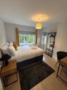 a bedroom with a large bed and a window at Colony Retreat in Dingle
