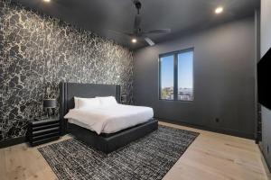 a bedroom with a bed and a large window at Isle Be Back in Destin +74 photos