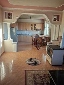 a large living room with a kitchen and dining room at Villa Elezi in Culaj +13 photos