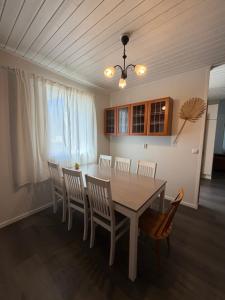 a dining room with a table and chairs at Apartment Koivikkotie in Savonlinna