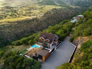 an aerial view of a house with a swimming pool at Aprie Boutique Hotel in Byurakan +51 photos