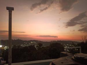 a sunset view from the balcony of a building at skyparking Golden cottage in Salem