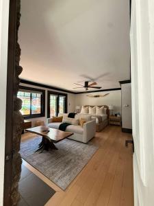 a living room with a couch and a table at Spacious 3 & 3 in Aspen's Core with Sauna in Aspen +7 photos