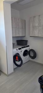 a washing machine with a fire inside of it at Útulný klidný pokoj B in Radošovice