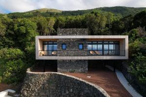 a house in the middle of a forest at Casa Aromas in Santo Amaro +7 photos