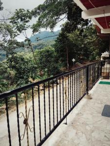 a balcony of a house with a view at Minca nomada 517 de la sierra in Santa Marta