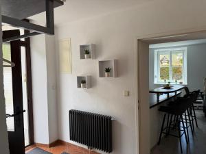 a living room with a table and a window at Ferienwohnung Nora in Vordernberg +12 photos
