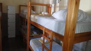 a couple of bunk beds in a room at MillaUno Hostel in Córdoba