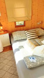 a bedroom with two beds in a room at Boutique Loft "Mrs Green" im Thayatal, Tiny Haus in Drosendorf Stadt +74 photos