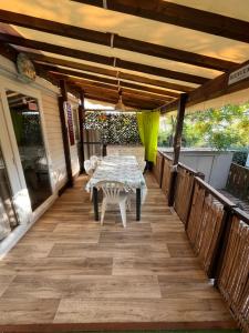 a patio with a table and chairs on it at VI05 Village 05 in Vias