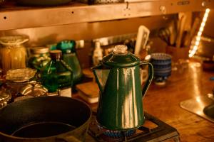 a green tea kettle sitting on top of a counter at Paradise Ranch Inn - Mindful Tent in Three Rivers