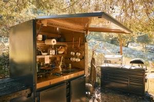 an outdoor kitchen with a sink and a stove at Paradise Ranch Inn - Mindful Tent in Three Rivers