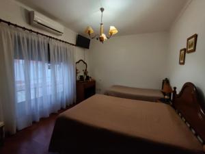a bedroom with a bed and a window at Alojamento Local Céu-Azul in Porto de Mós +68 photos