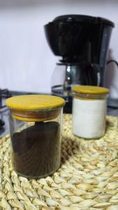 two containers of food sitting on top of a table at Green Apartment el prado in Girón +29 photos
