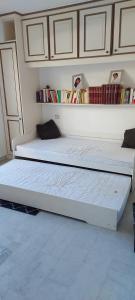 two beds sitting next to each other in a room at Cannes Park in Cannes