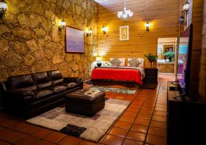 a bedroom with a bed and a couch in a room at Hotel Boutique Matea in Ixtapan de la Sal +89 photos