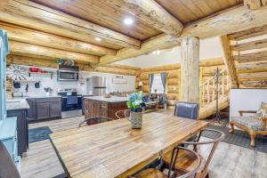 a kitchen and dining room with a wooden table and chairs at 'Rustic Cliff Ranch' in Uintah Basin: Dogs Welcome in Fort Duchesne