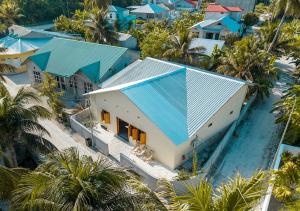an aerial view of a house with a blue roof at Sansara Maldives - The Untouched South, Easy Access via Sri Lanka in Meedhoo