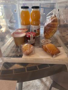 a refrigerator filled with lots of food and drinks at Studio Privatif - Ancienne Maison Vigneronne in Châtel-Guyon +17 photos