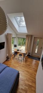 a bedroom with a bed and a table with chairs at HavsBo in Västerhaninge