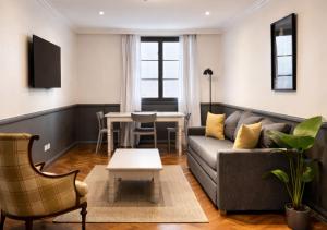 a living room with a couch and a table at Moreno 820 by DOT Suites in Buenos Aires +31 photos