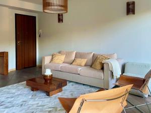 a living room with a couch and a coffee table at VistaLago Loft in Sarnico