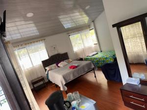 a bedroom with a bed and a bed sidx sidx sidx sidx sidx at Cabañas Bosque Encanto - Jacuzzi in San Francisco +5 photos