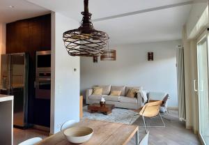 a living room with a couch and a table at VistaLago Loft in Sarnico