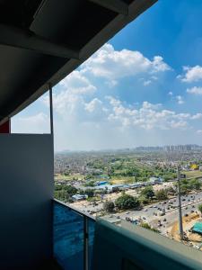 a view of a city from a building balcony at Unique property in Ghaziabad
