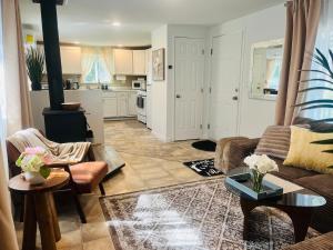 a living room with a couch and a table at Dafna, Unit 3 - Two Bedroom, One Bath in Cromberg
