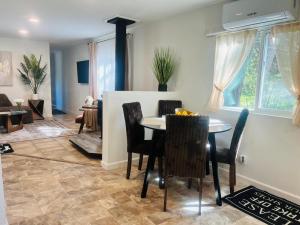 a dining room and living room with a table and chairs at Dafna, Unit 3 - Two Bedroom, One Bath in Cromberg