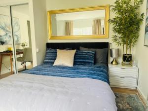 a bedroom with a large bed with a mirror at Dafna, Unit 3 - Two Bedroom, One Bath in Cromberg