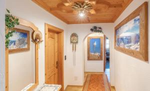 a hallway with a door and a ceiling at Ferienwohnung ZUGSPITZE in Krün +12 photos