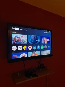 a flat screen tv hanging on a wall at BlackView in Kota Kinabalu
