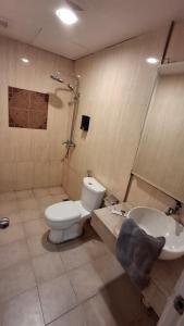 a bathroom with a toilet and a sink at BlackView in Kota Kinabalu