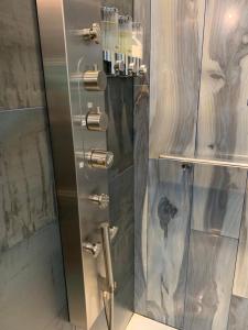 a shower with a glass door in a bathroom at Riverhouse Hidden Gem in The Dalles