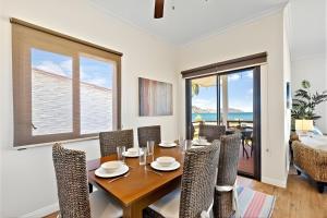 a dining room with a table and chairs at Pacific Beach 9 - Beachfront Condo, BBQ, pool, prime location, sleeps 4 in Potrero