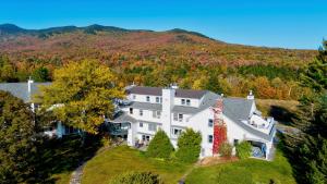 an aerial view of a large house on a hill at Lodge Condo 26 in Stowe