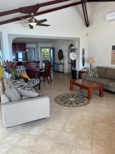a living room with a couch and a table at Ballena Bay Villa Lot 45 Villa del Mar in Tambor