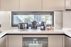 a kitchen with a counter top with appliances on it at Luxurious Villa Private Pool Private Beach Views in Bodrum City