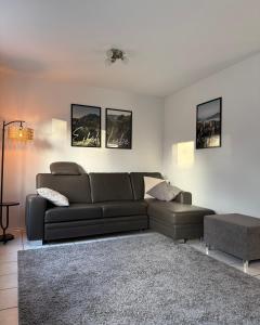 a living room with a couch and a table at Ferienhaus Eiforia in Gerolstein